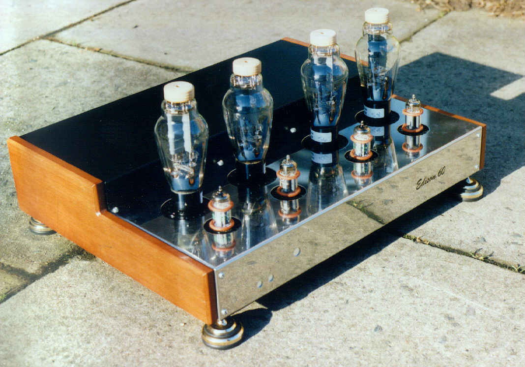 Photograph: the finished amplifier, a polished steel and black chassis with wooden side cheeks, two 300B valves and two small driver valves per side