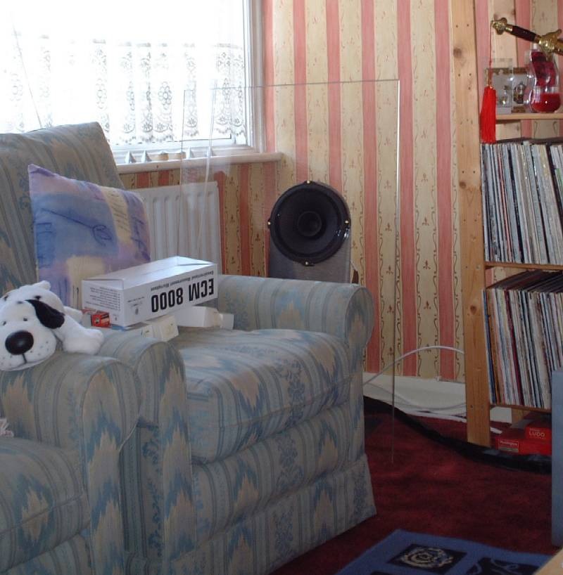 Photograph: a Transparence in front of a window, with an armchair in the foreground