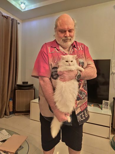 Thorsten holding a white cat